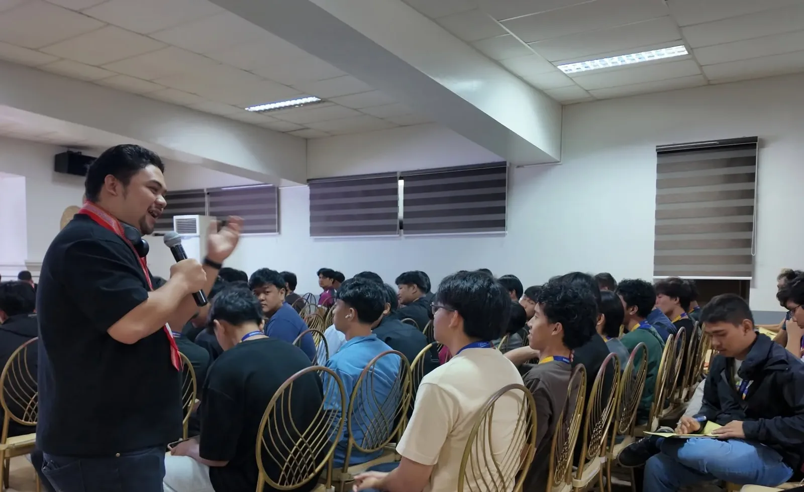 Students in rows during the exercises at ITE Day 2026, one taking notes.